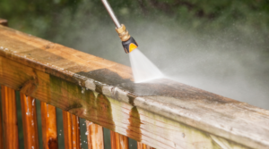 proper soft wash pressure washing of wooden backyard deck railing